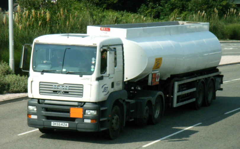 a large truck that is driving down the street