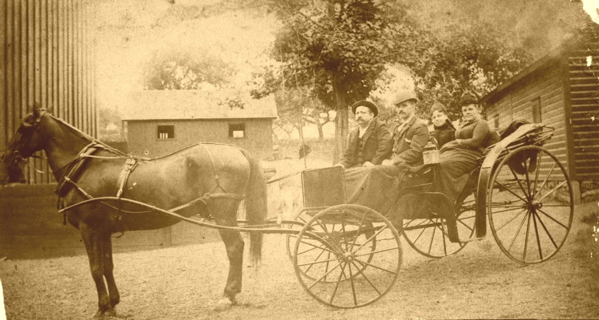 a horse drawn carriage sitting next to two people