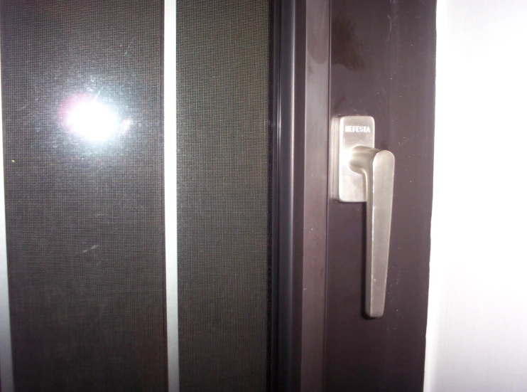 an elegant looking door handle has been designed to match the wall