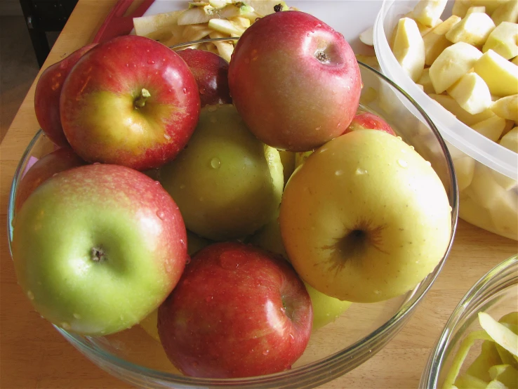 apples and other fresh fruit sitting on top of a table