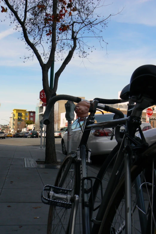 a bicycle is locked on a city street