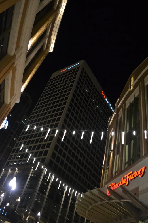 a city street at night with lights shining down