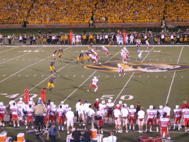 a football game in the middle of a stadium