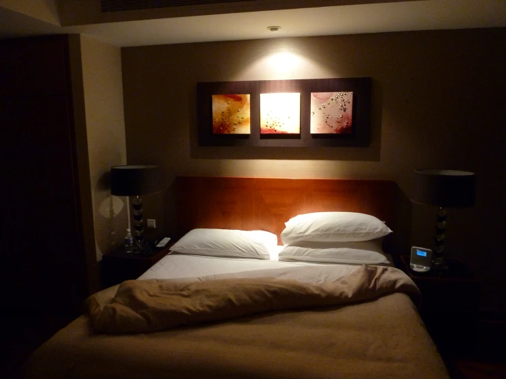 a bedroom lit up with two square window frames