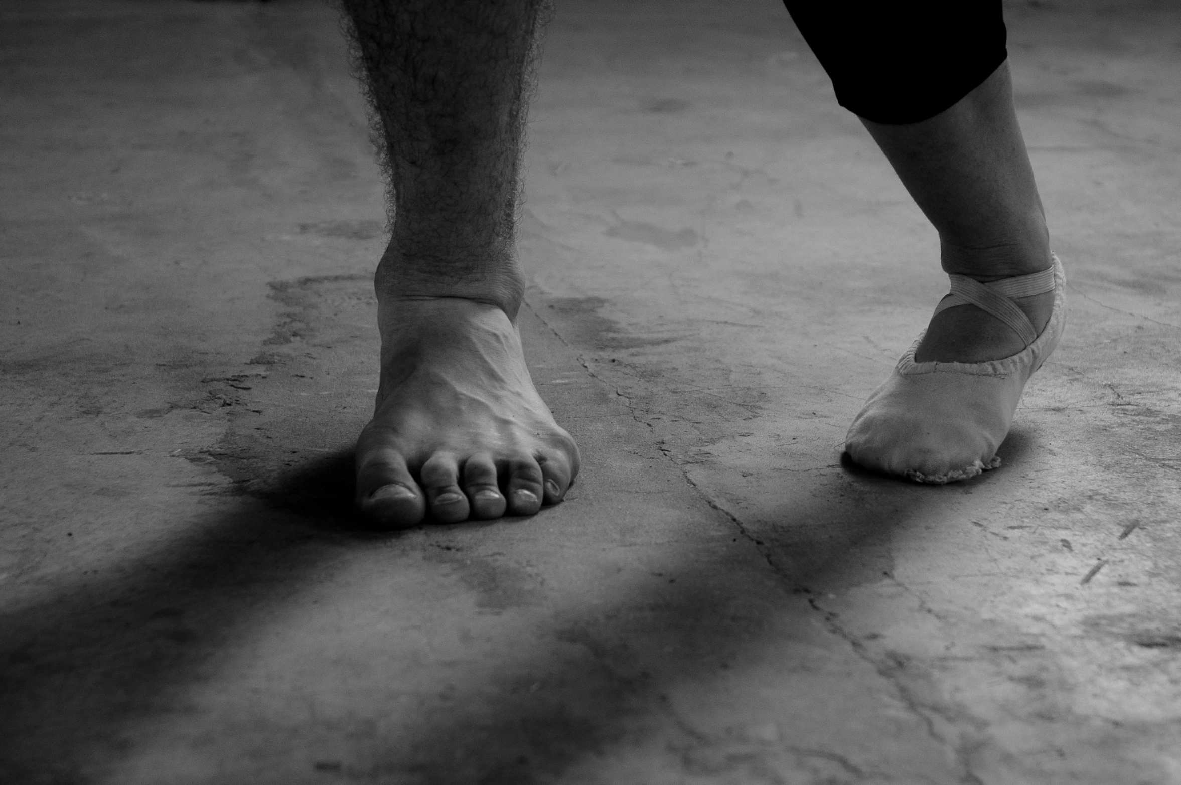 a black and white picture of a person's feet and feet