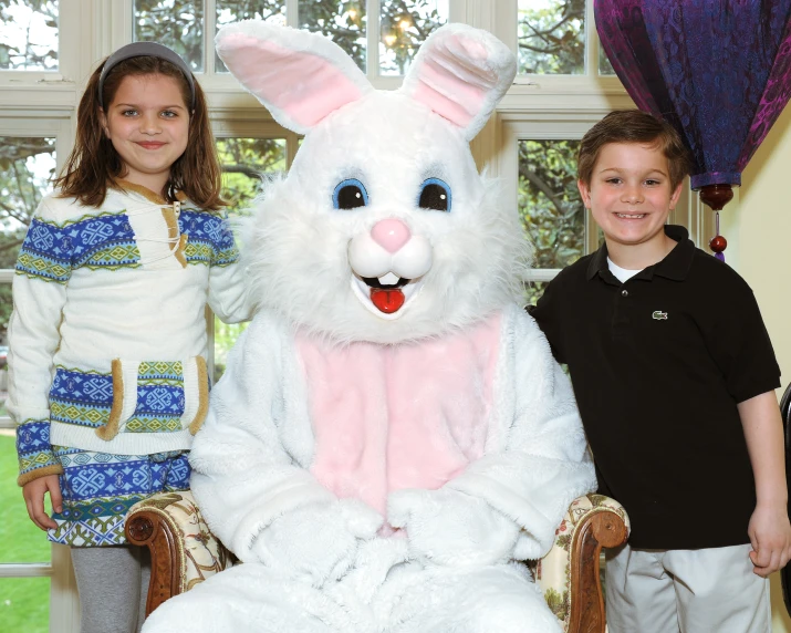 children pose for a po with the easter bunny