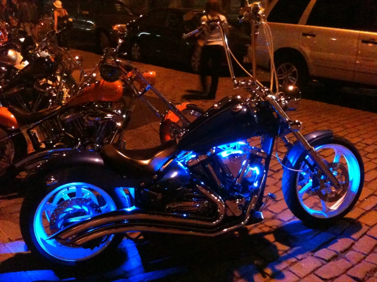 a custom motorcycle sitting by itself at night