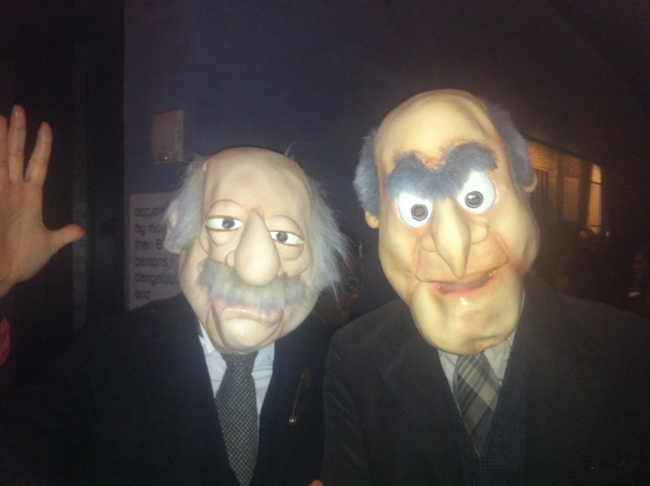 two puppets in suits are dressed like people