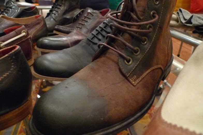 men's boots are lined up next to each other