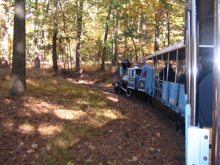 an image of people that are riding on the train