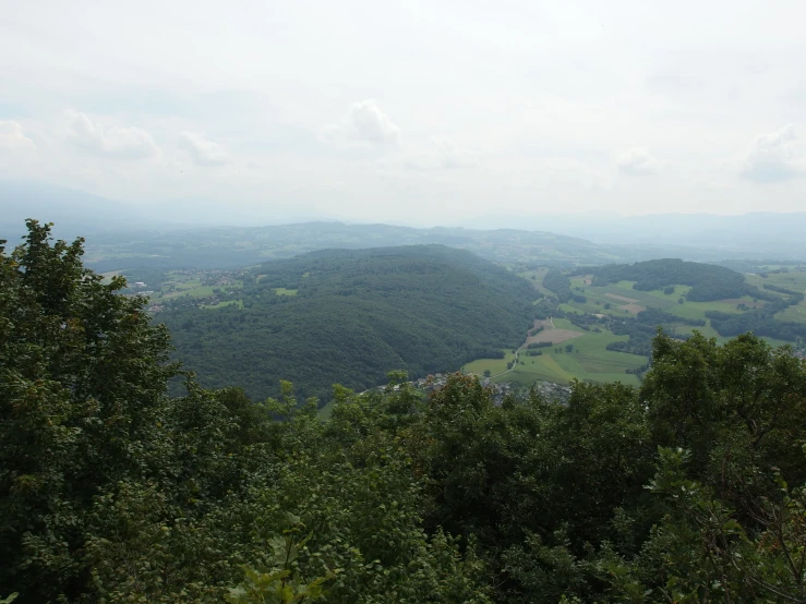 view from a hilltop in the middle of the countryside