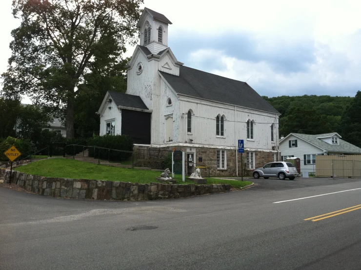 a church with a steeple on a corner