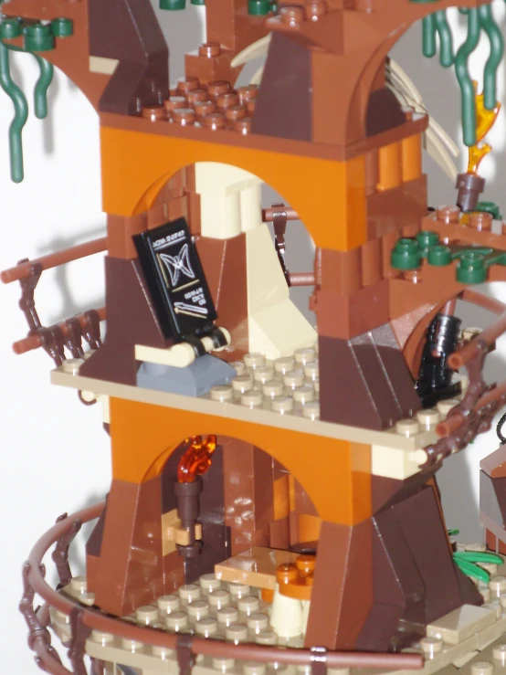 a lego treehouse sits atop of the wooden frame