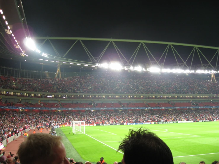 a soccer stadium with people on the field