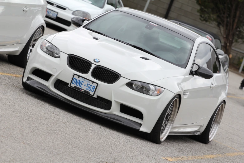 two cars that are driving down the street