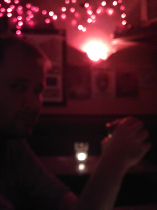 a man at a table in a dimly lit area