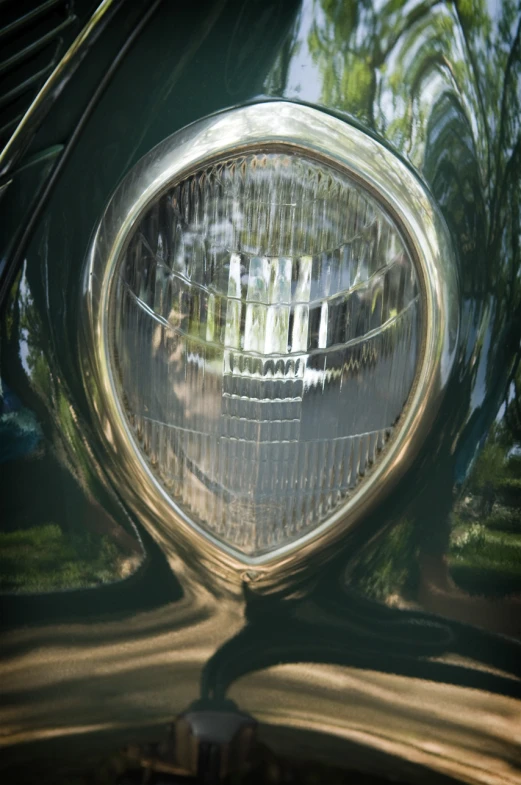 a close up of the light on a classic car