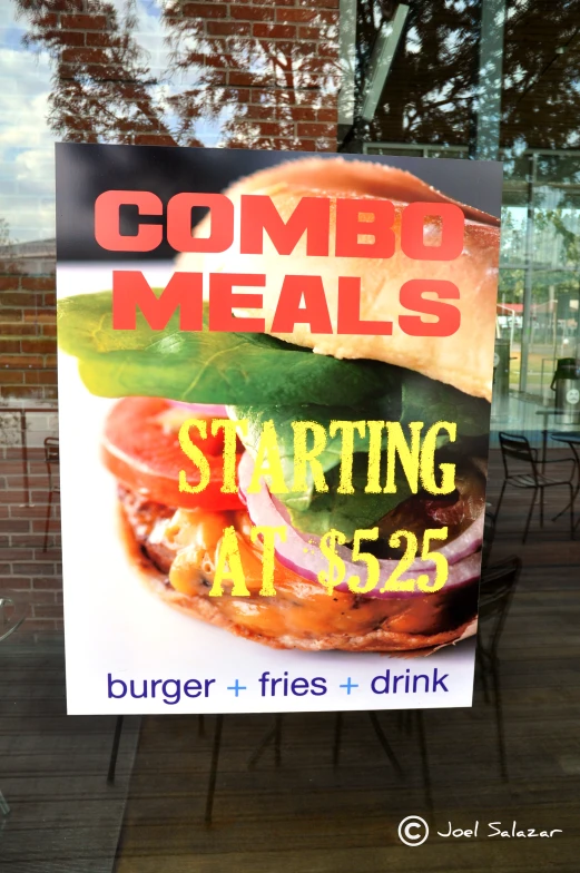 a sign is posted on the side of a door for a restaurant