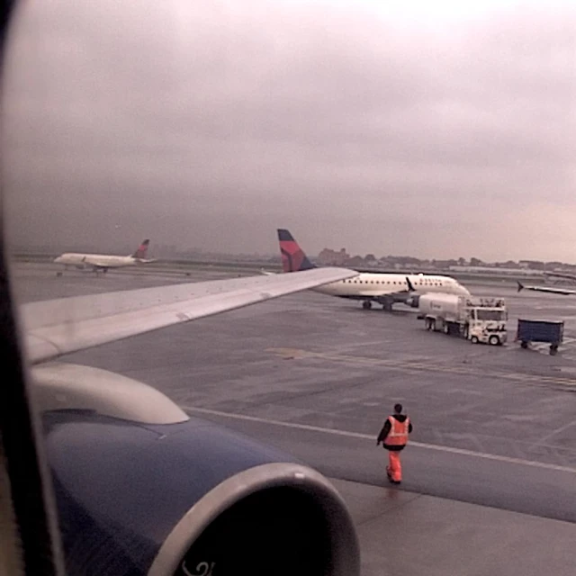 a large jetliner sitting on top of an airport runway