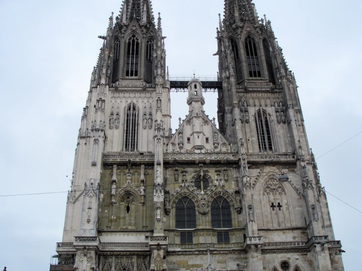 a very tall building with lots of windows and spires