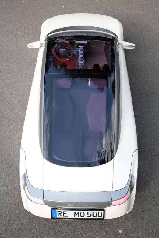 a white and black car parked on top of a street