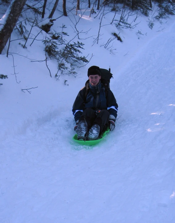 a  is sledding down a hill