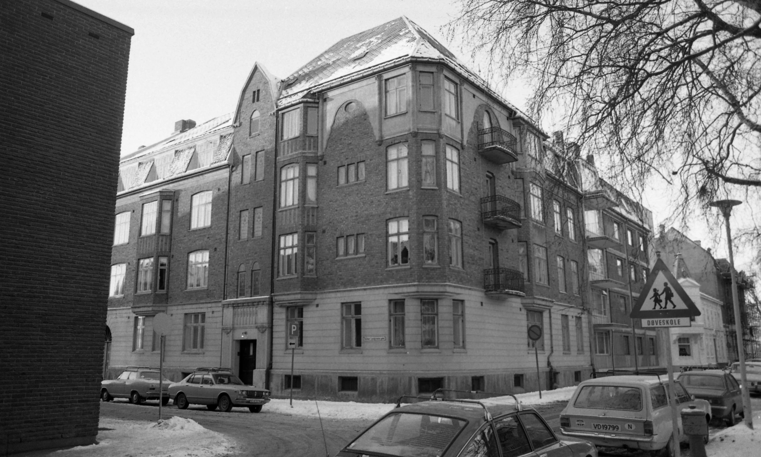 black and white pograph of some very old apartment buildings