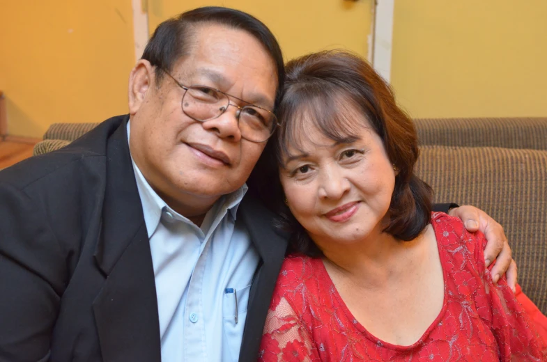 a man and woman who are together posing for the camera