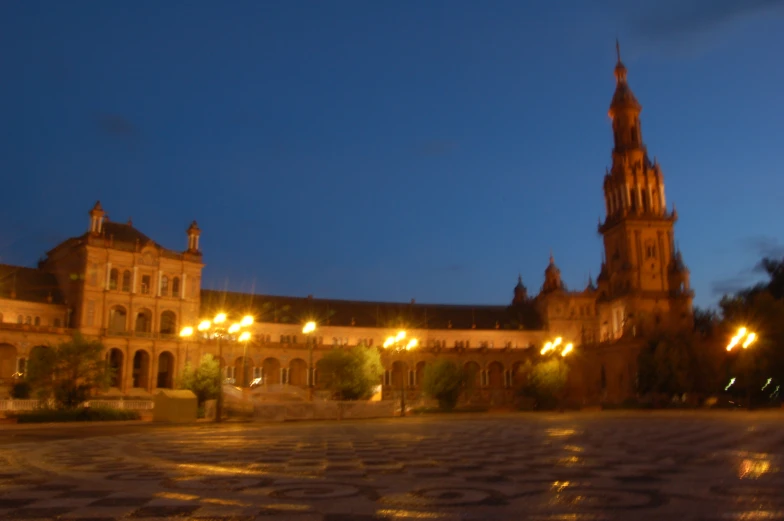 a clock tower on a building with many street lights