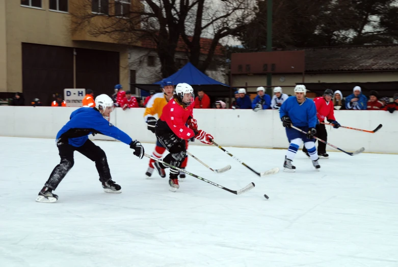 children playing on an ice rink in a team sport