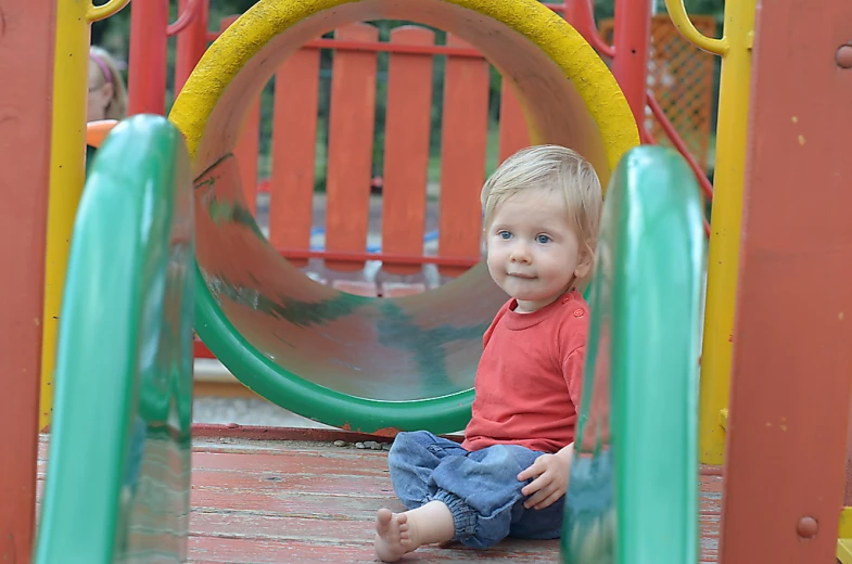 a  sitting on top of a slide