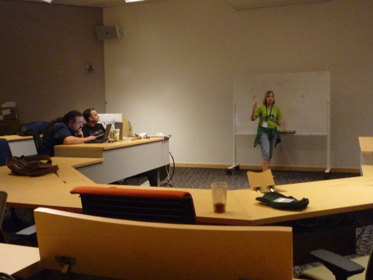 a group of people sitting in an office meeting room