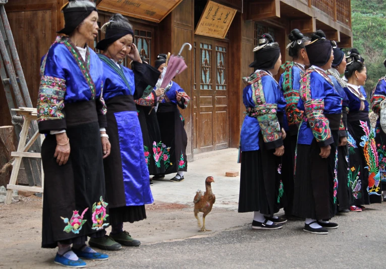 several people dressed in native thai clothing