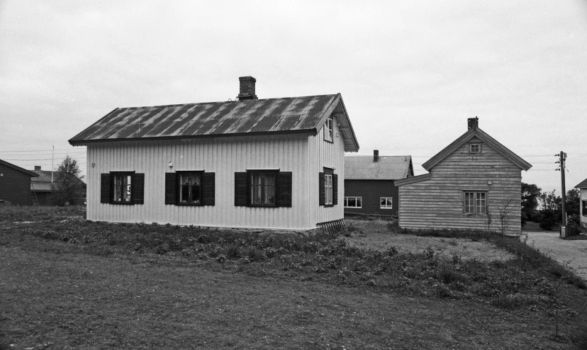 black and white image of old house with windows