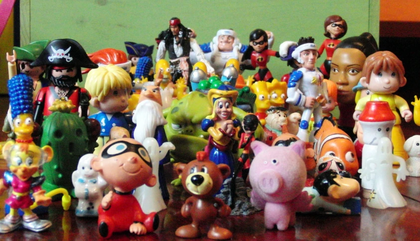 toys sitting on a table with an assortment of them