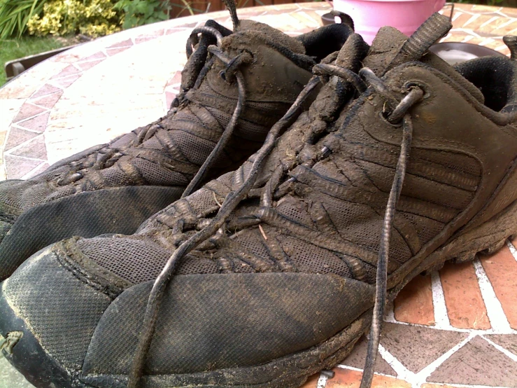 a pair of brown shoes are sitting on the ground