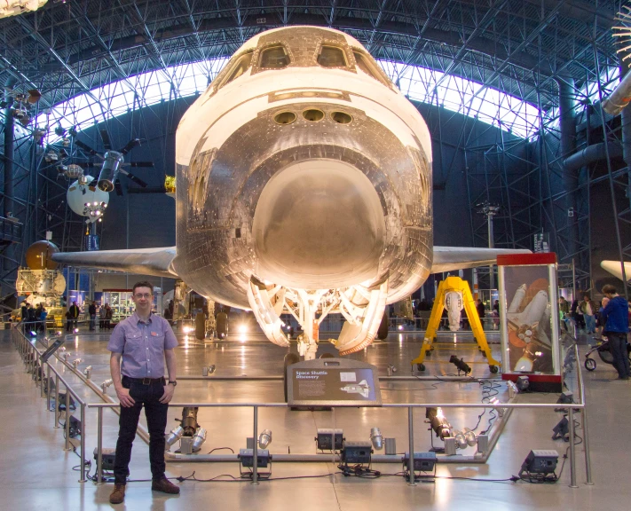 a person standing in front of an airplane