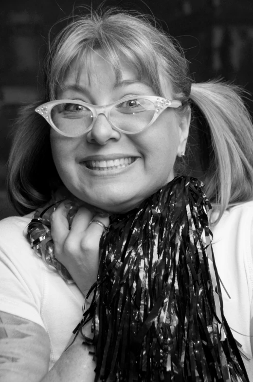 a woman wearing glasses and a black scarf