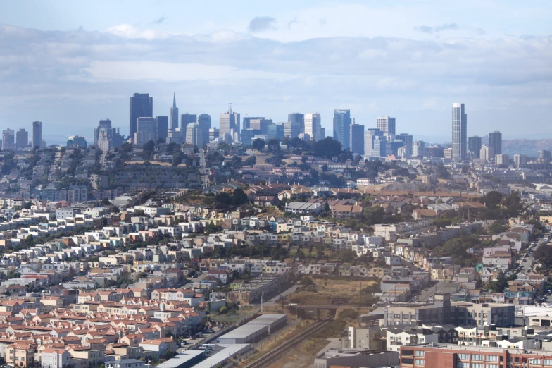 view of the city skyline with a lot of houses and skyscrs