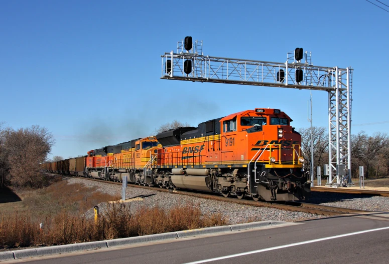 a train is riding along the railroad tracks