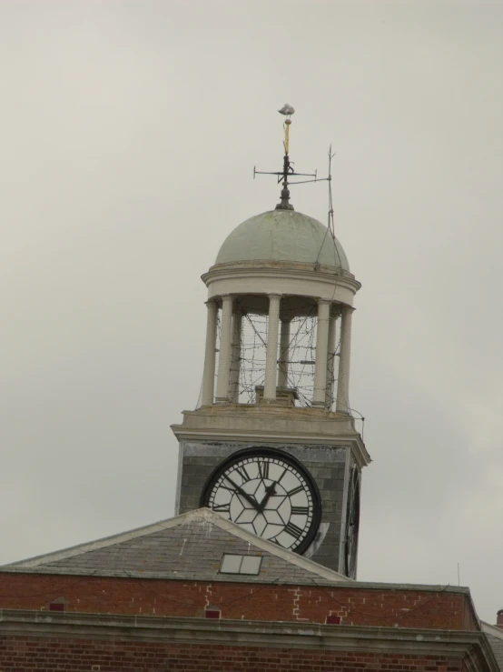 there is a large clock at the top of a building