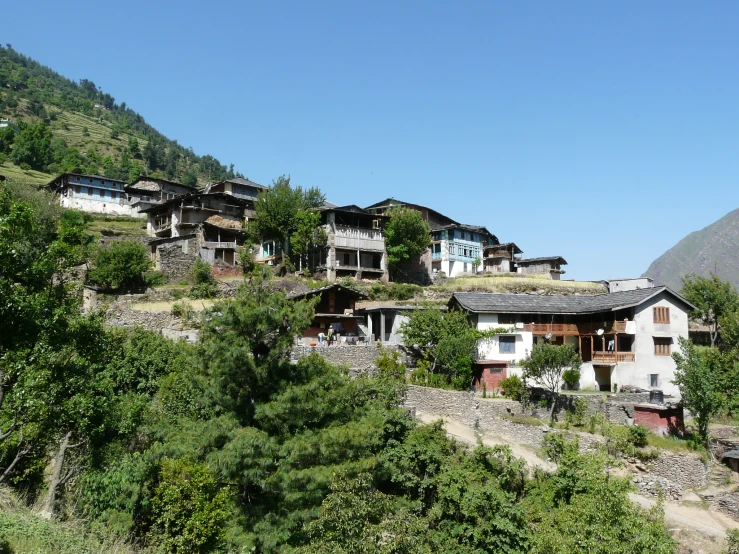 a group of wooden buildings on top of a mountain