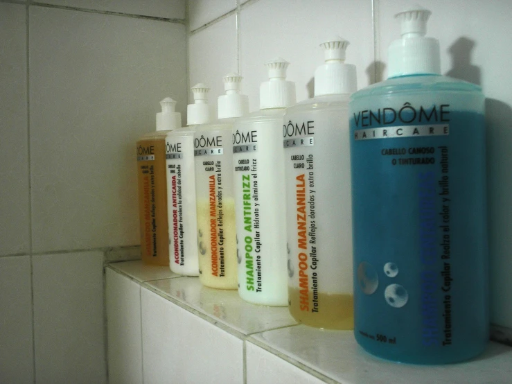 a shelf topped with different types of hand and body care