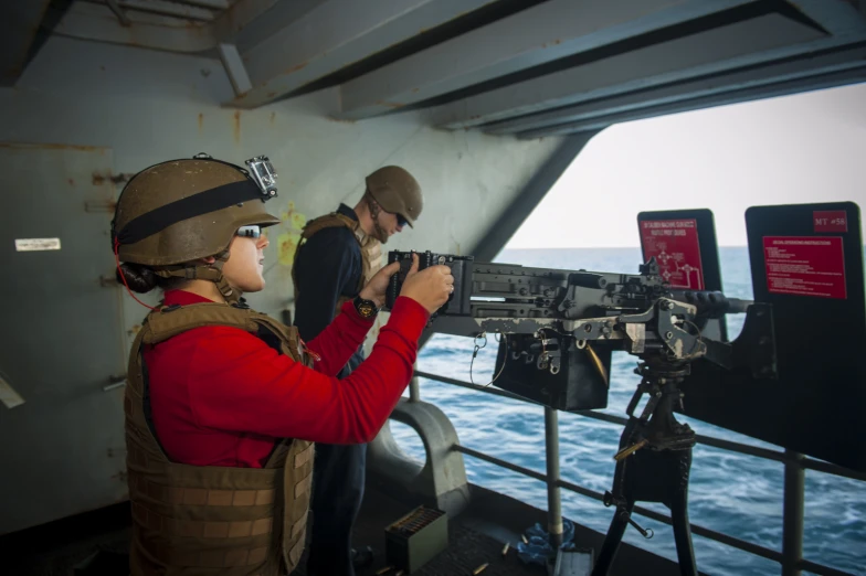 two people on a ship with guns in hand