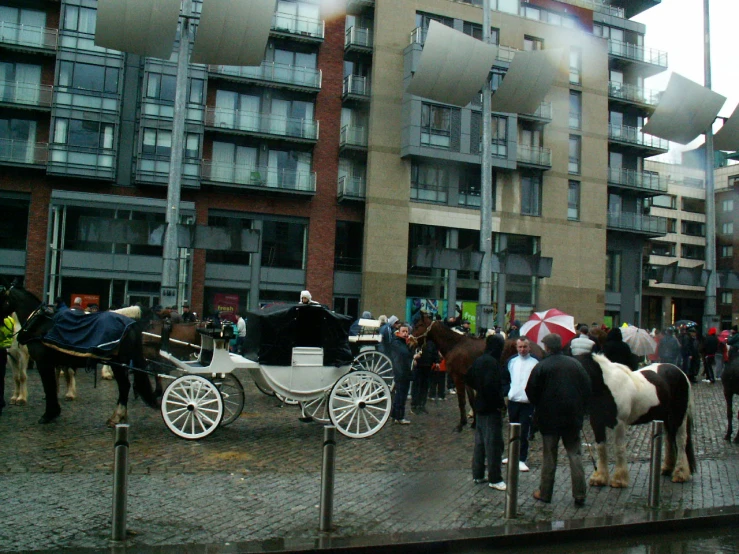 horse drawn carriage sitting in front of a building