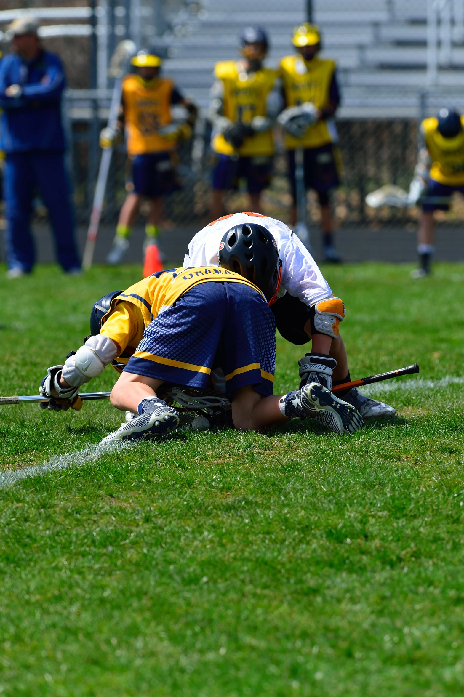 a group of young men in the field playing sports