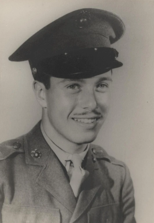 a man in military uniform smiling for a pograph