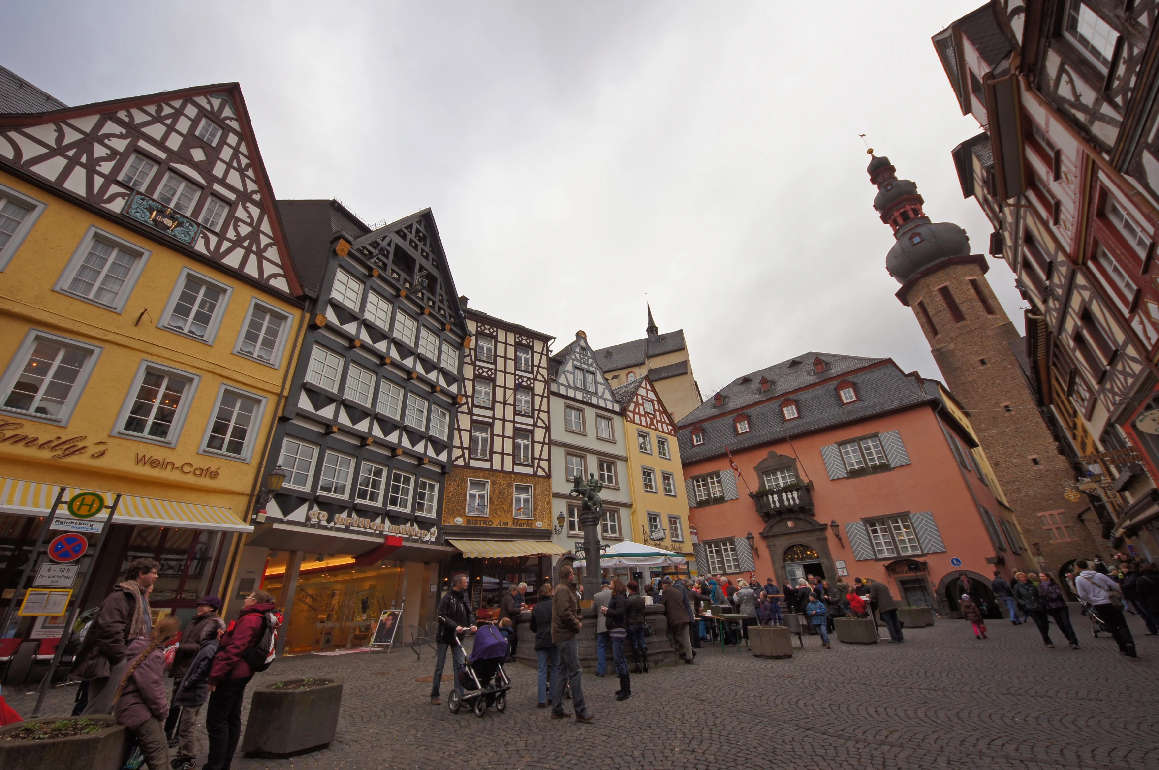 old buildings line a cobblestone street in a european old city