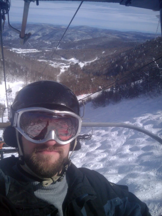 a man riding skis on a snow covered slope