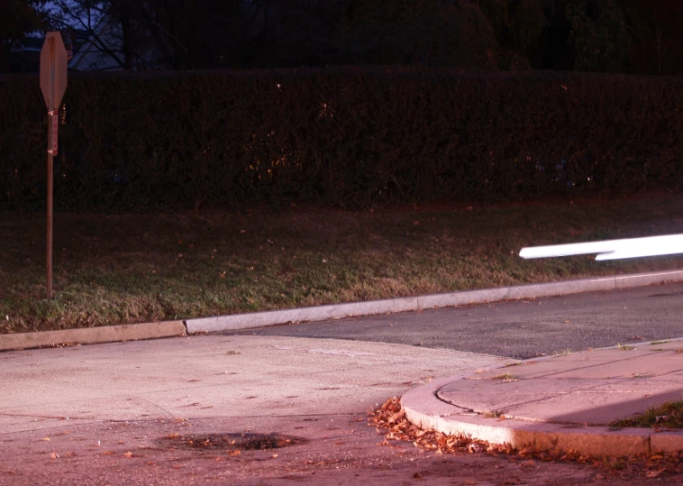 a stop light and street signs at a park side